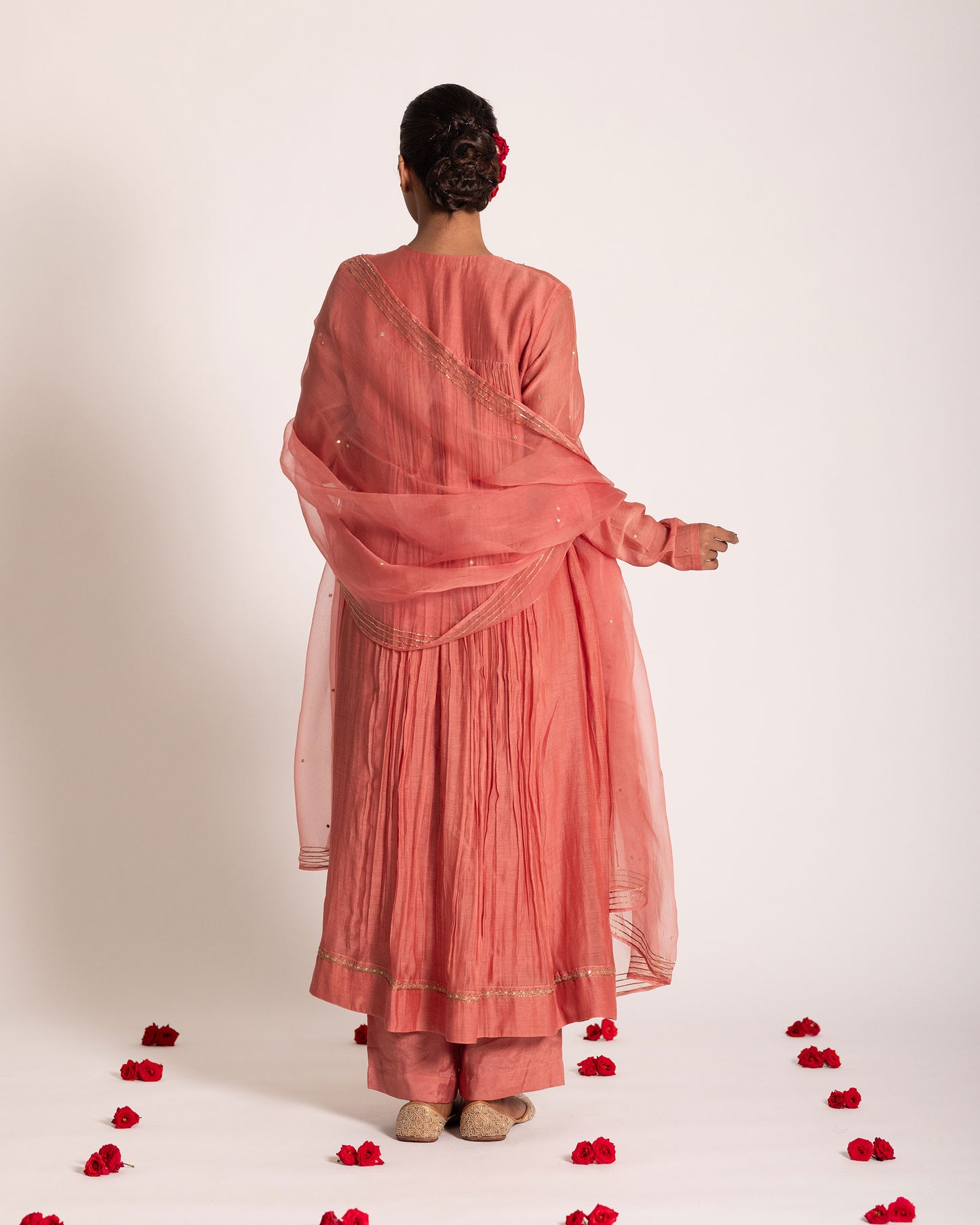 Dark peach gathered salwar set with warm elegant tones and fluid drape, designed for a graceful and effortlessly refined ethnic look.