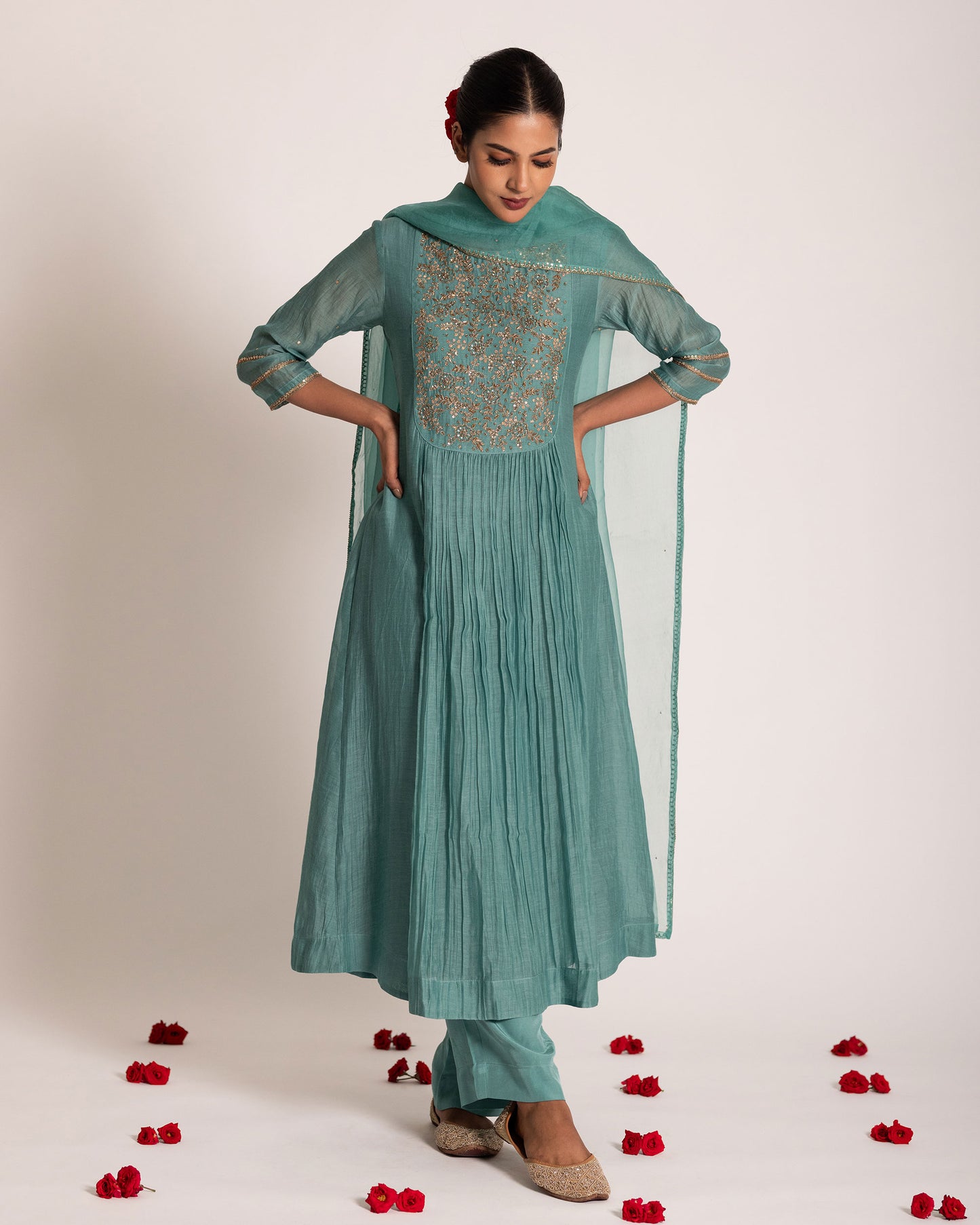 Teal blue gathered salwar set with rich jewel tones and graceful drape, crafted for a sophisticated and effortlessly elegant ethnic look.