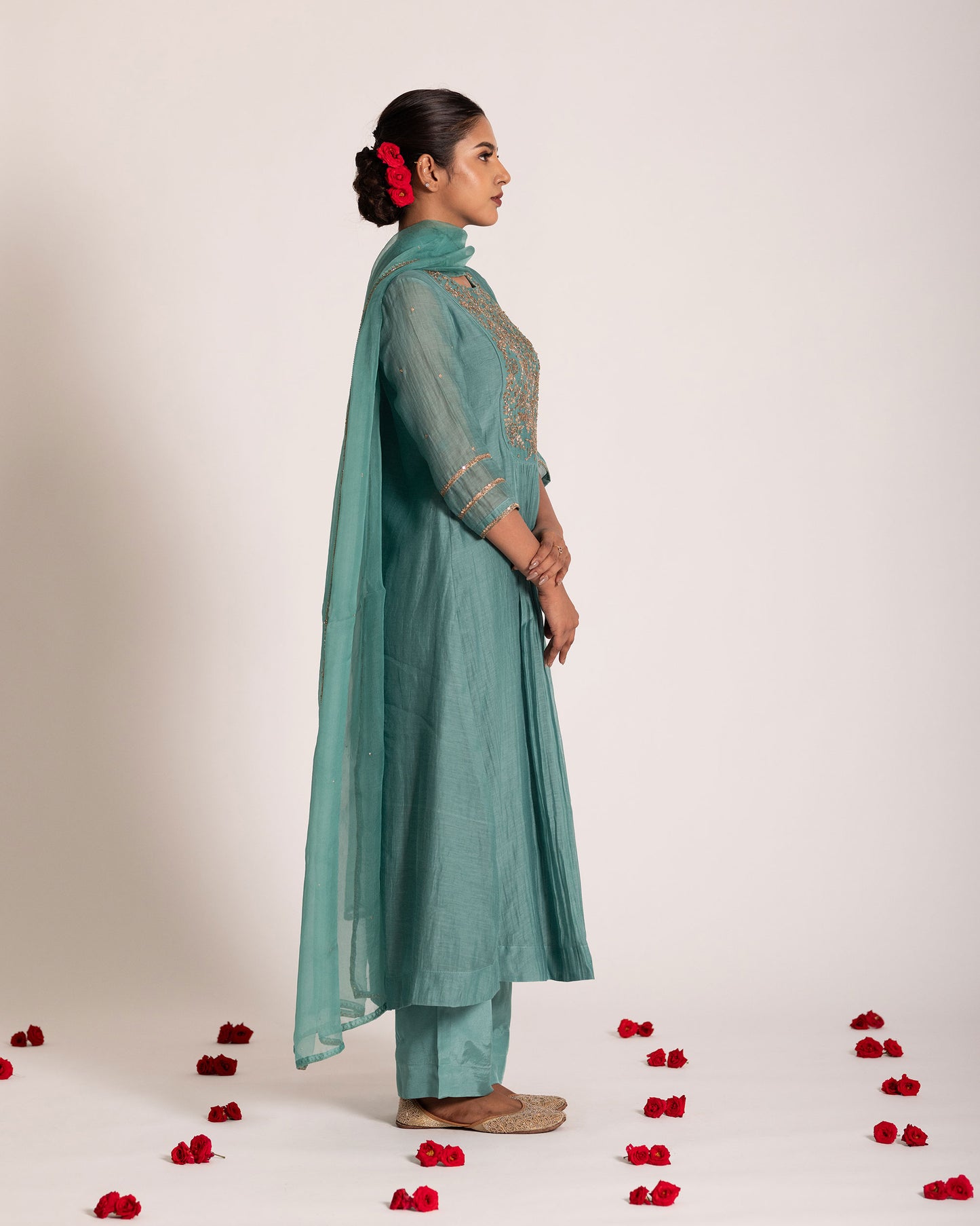 Teal blue gathered salwar set with rich jewel tones and graceful drape, crafted for a sophisticated and effortlessly elegant ethnic look.