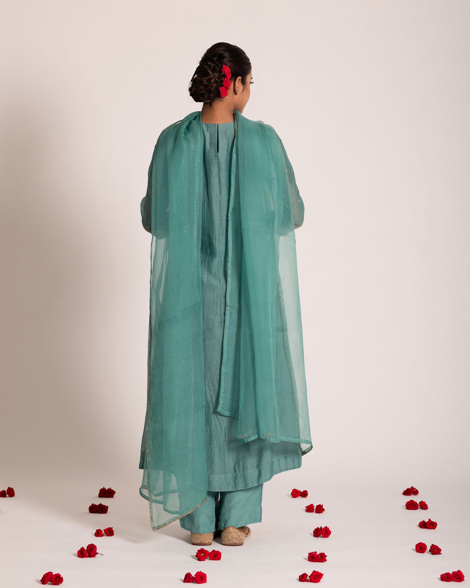 Teal blue gathered salwar set with rich jewel tones and graceful drape, crafted for a sophisticated and effortlessly elegant ethnic look.