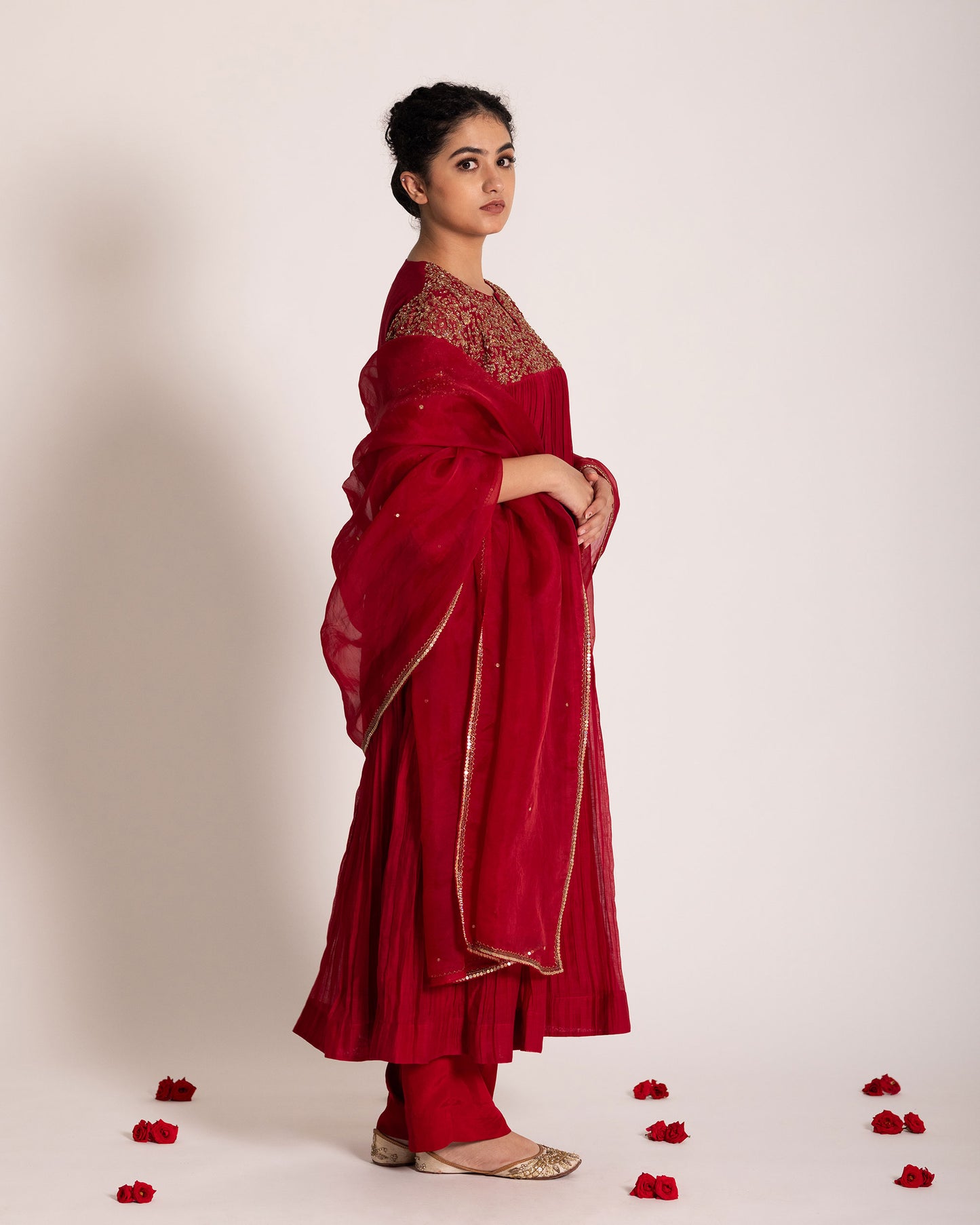 Red gathered salwar set with vibrant festive charm and flowing elegance, designed for a bold and timeless ethnic statement.