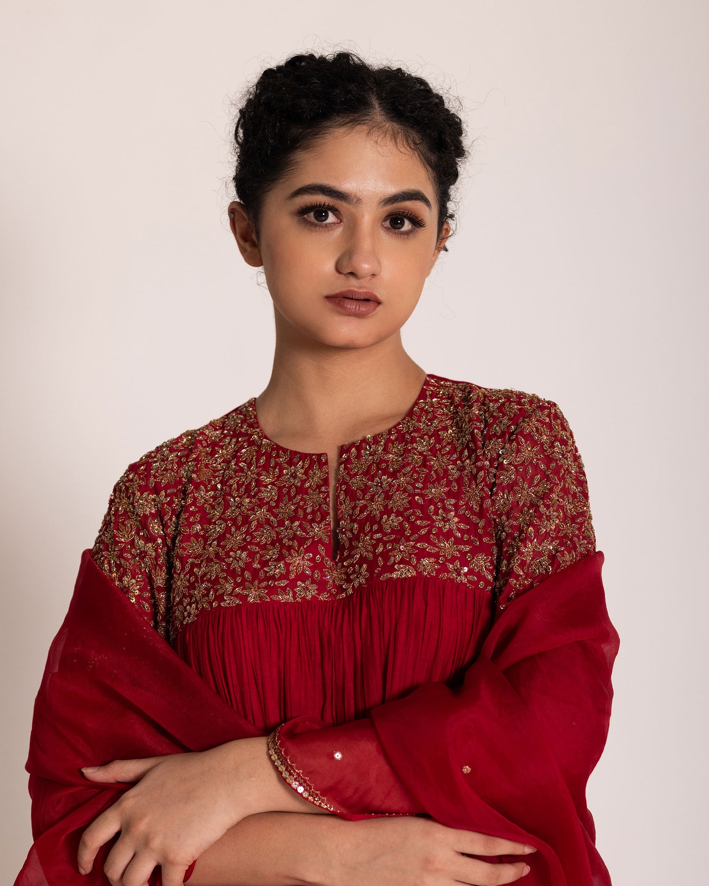 Red gathered salwar set with vibrant festive charm and flowing elegance, designed for a bold and timeless ethnic statement.