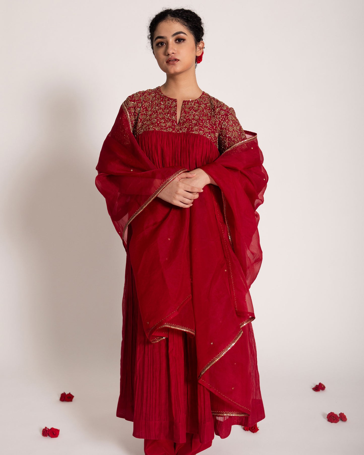 Red gathered salwar set with vibrant festive charm and flowing elegance, designed for a bold and timeless ethnic statement.