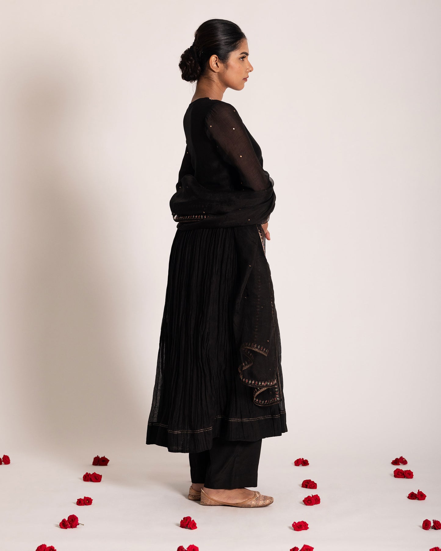 Black Aliya cut salwar set with sleek silhouette and timeless elegance, crafted for a bold, sophisticated, and graceful ethnic statement.