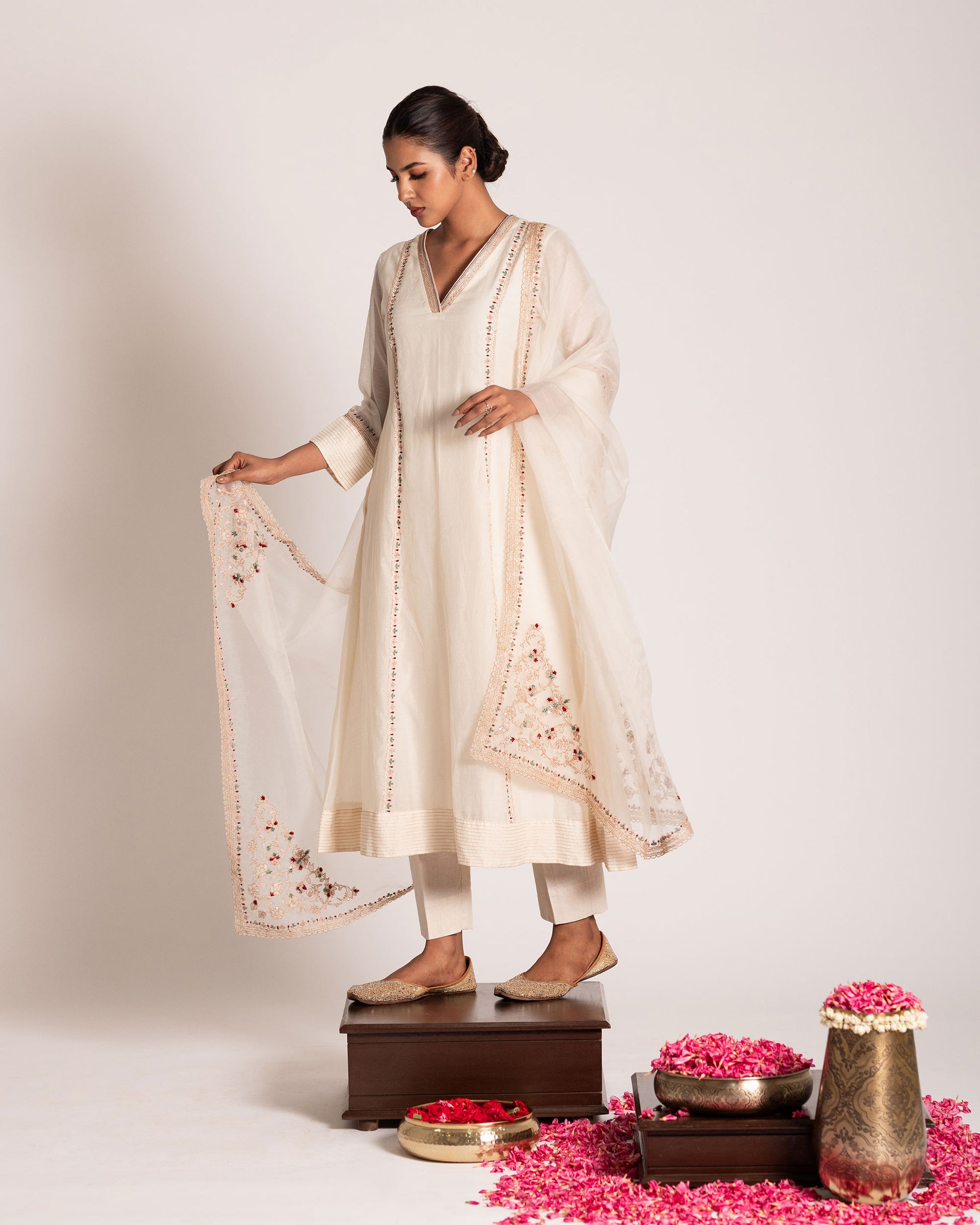 Pearl white salwar set with pristine elegance and timeless charm, crafted for a graceful and sophisticated ethnic look.