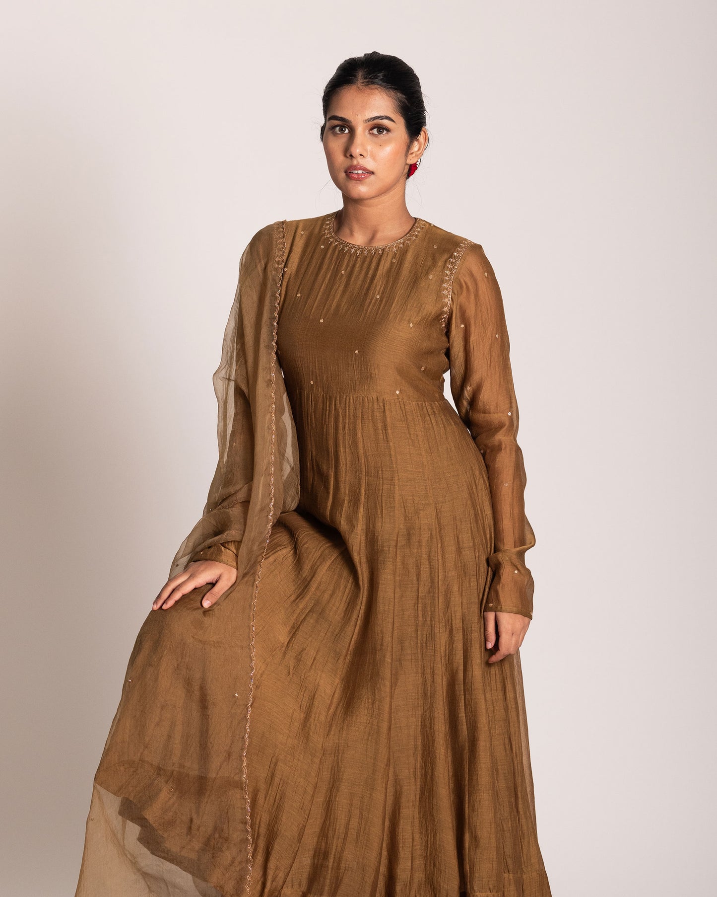 Golden caramel salwar set with rich warm tones and refined elegance, designed for a graceful and sophisticated ethnic statement.