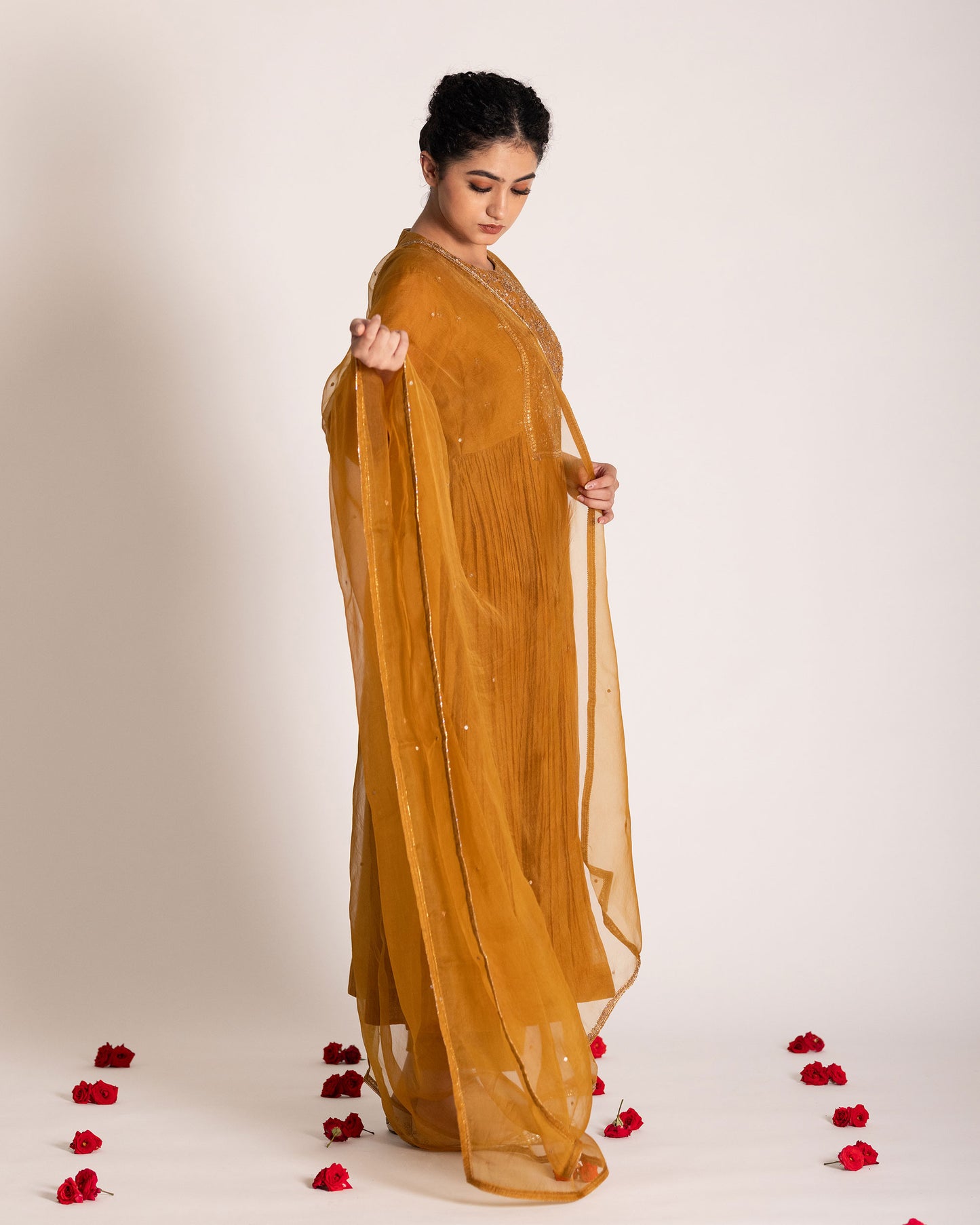 Burnt yellow salwar set with warm earthy tones and elegant styling, crafted for a radiant and timeless ethnic look.