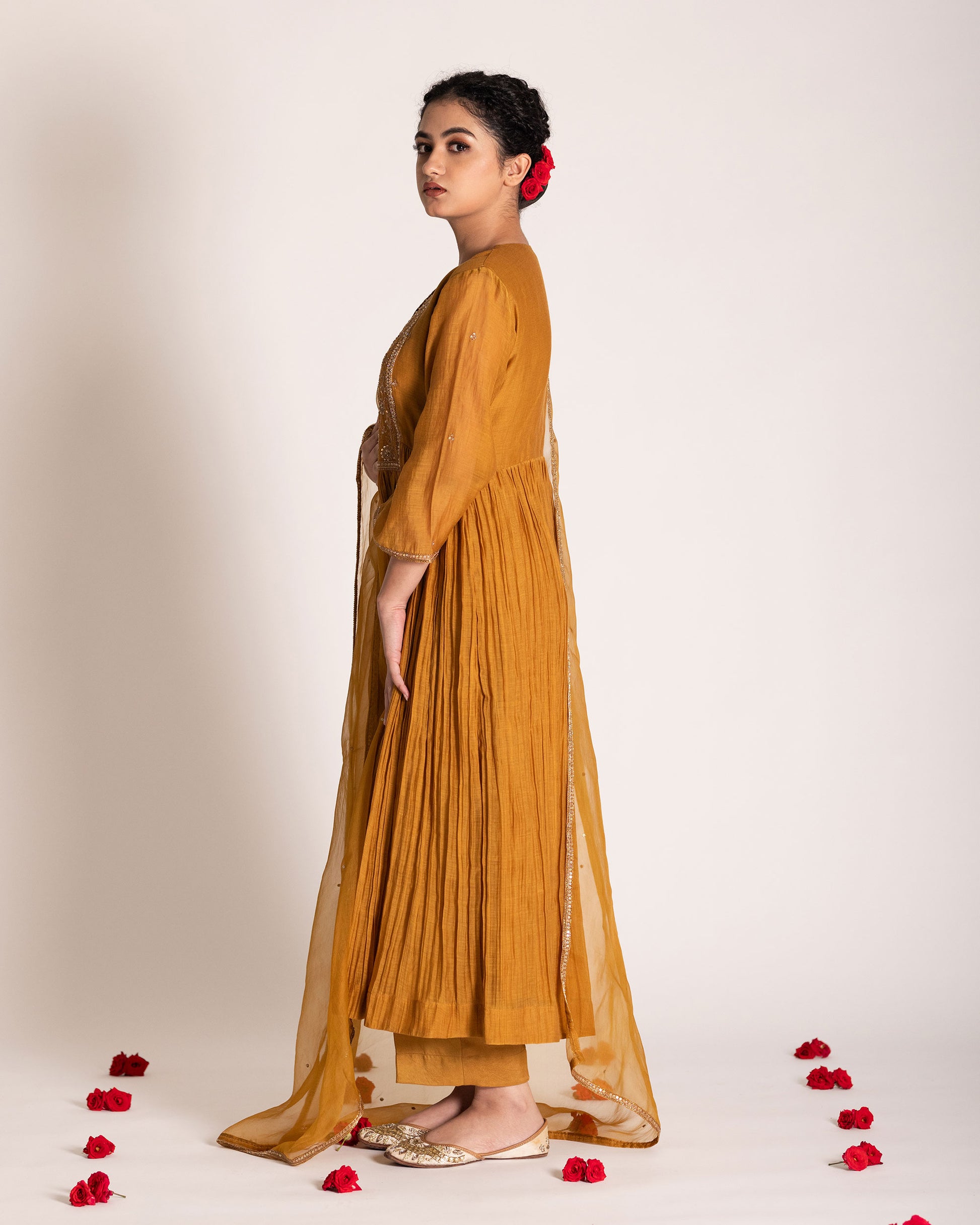 Burnt yellow salwar set with warm earthy tones and elegant styling, crafted for a radiant and timeless ethnic look.