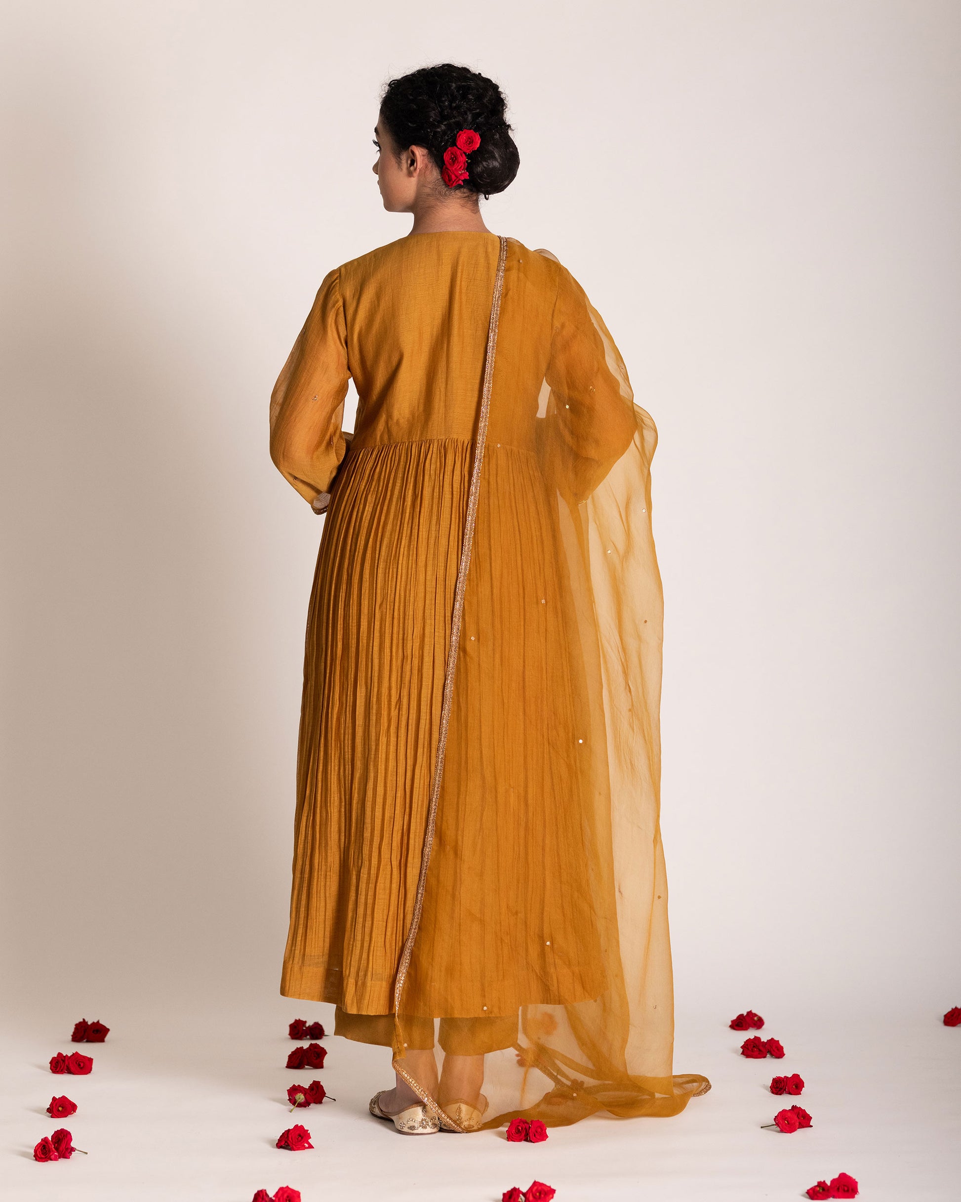 Burnt yellow salwar set with warm earthy tones and elegant styling, crafted for a radiant and timeless ethnic look.