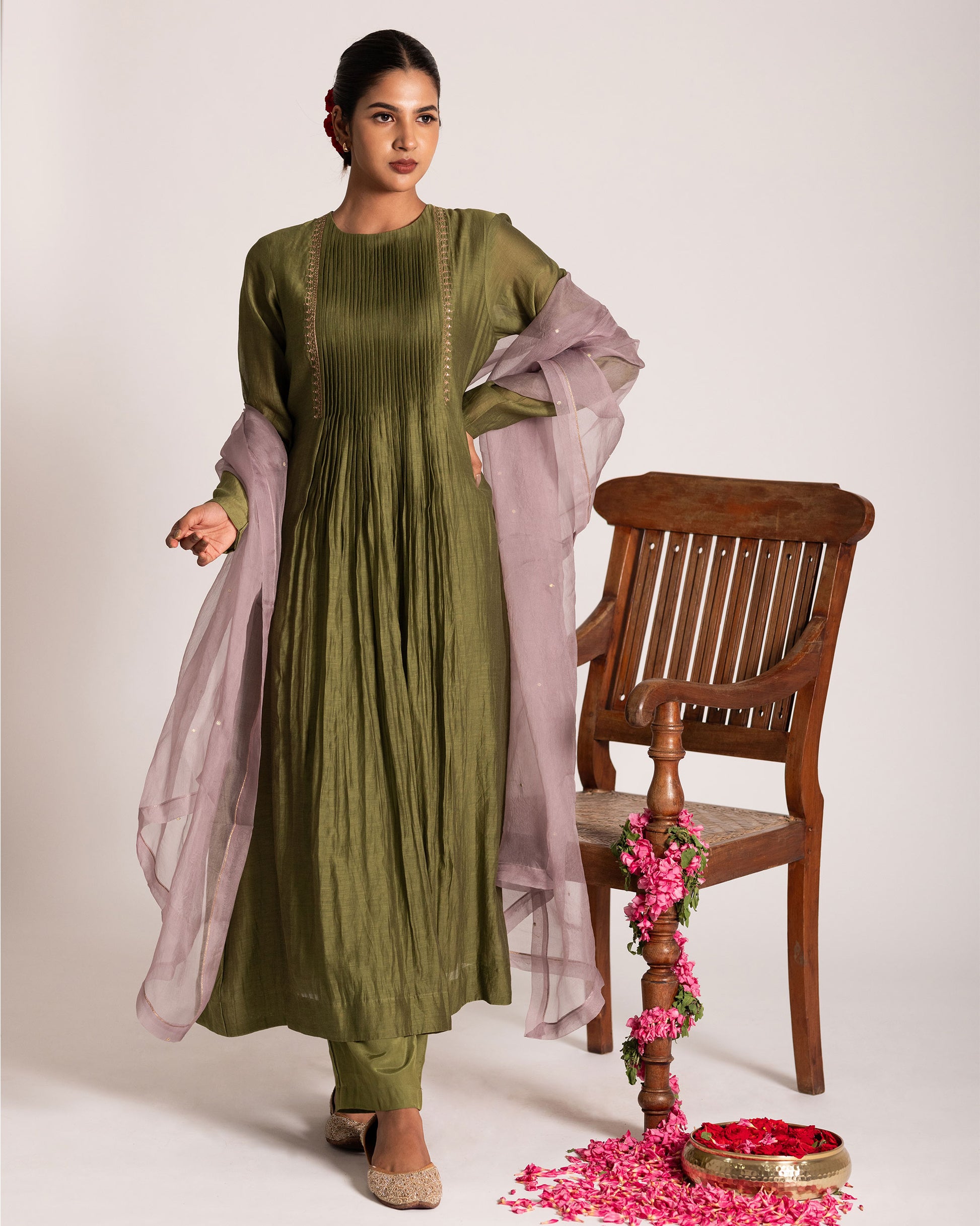 Green and light mauve centre pleated suit with graceful color harmony and refined silhouette, designed for an elegant and contemporary ethnic look.