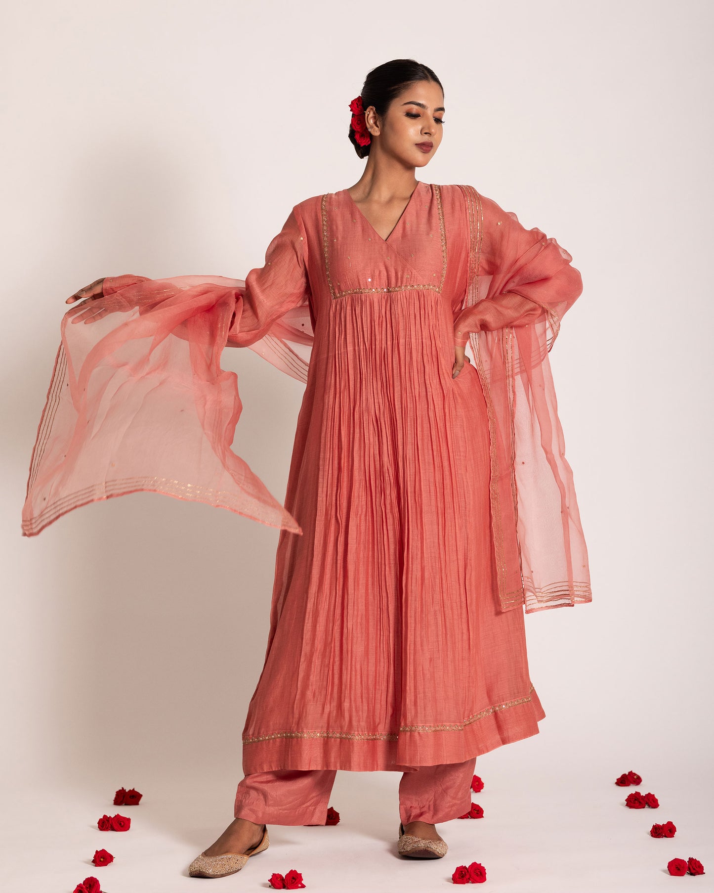 Dark peach gathered salwar set with warm elegant tones and fluid drape, designed for a graceful and effortlessly refined ethnic look.