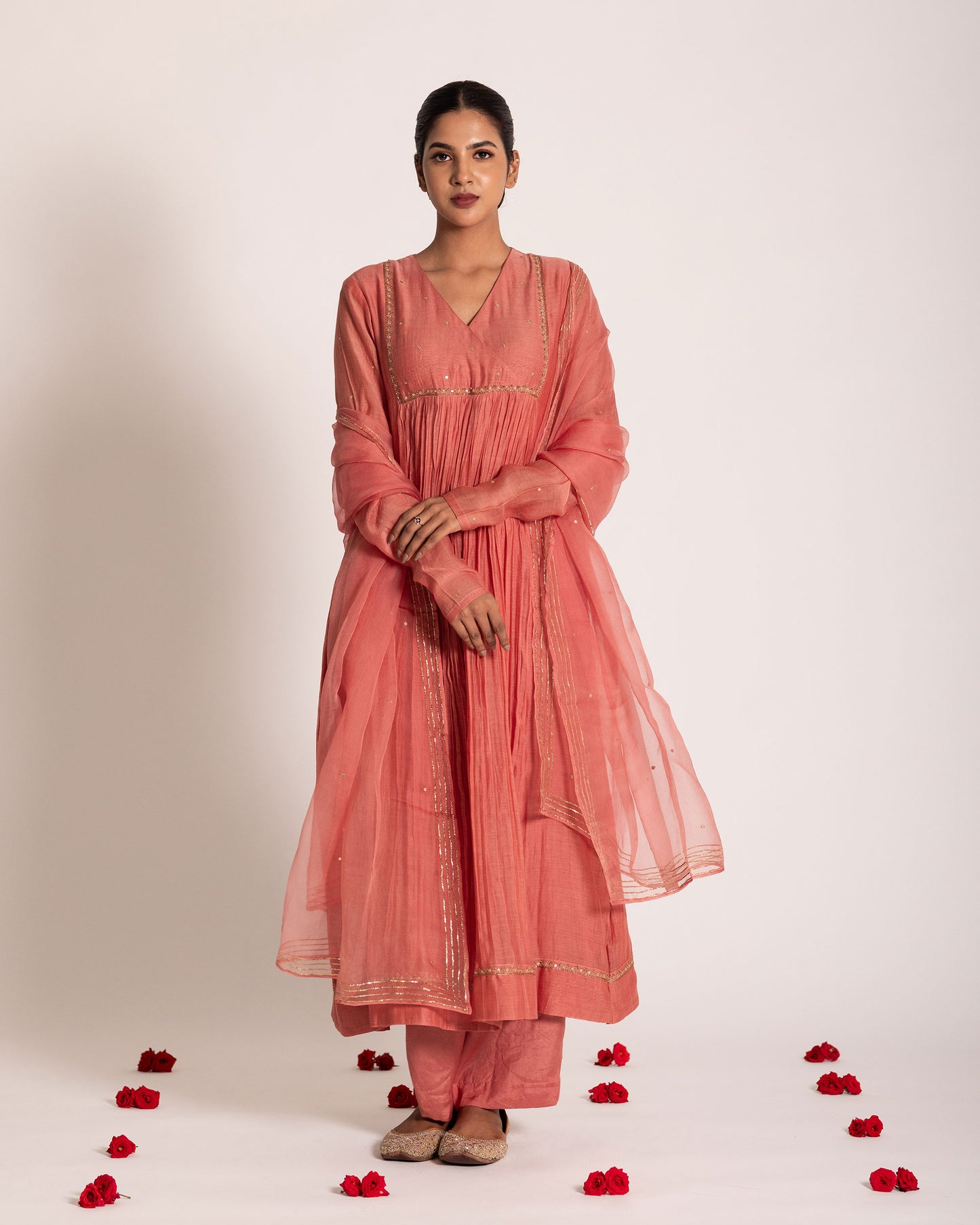 Dark peach gathered salwar set with warm elegant tones and fluid drape, designed for a graceful and effortlessly refined ethnic look.