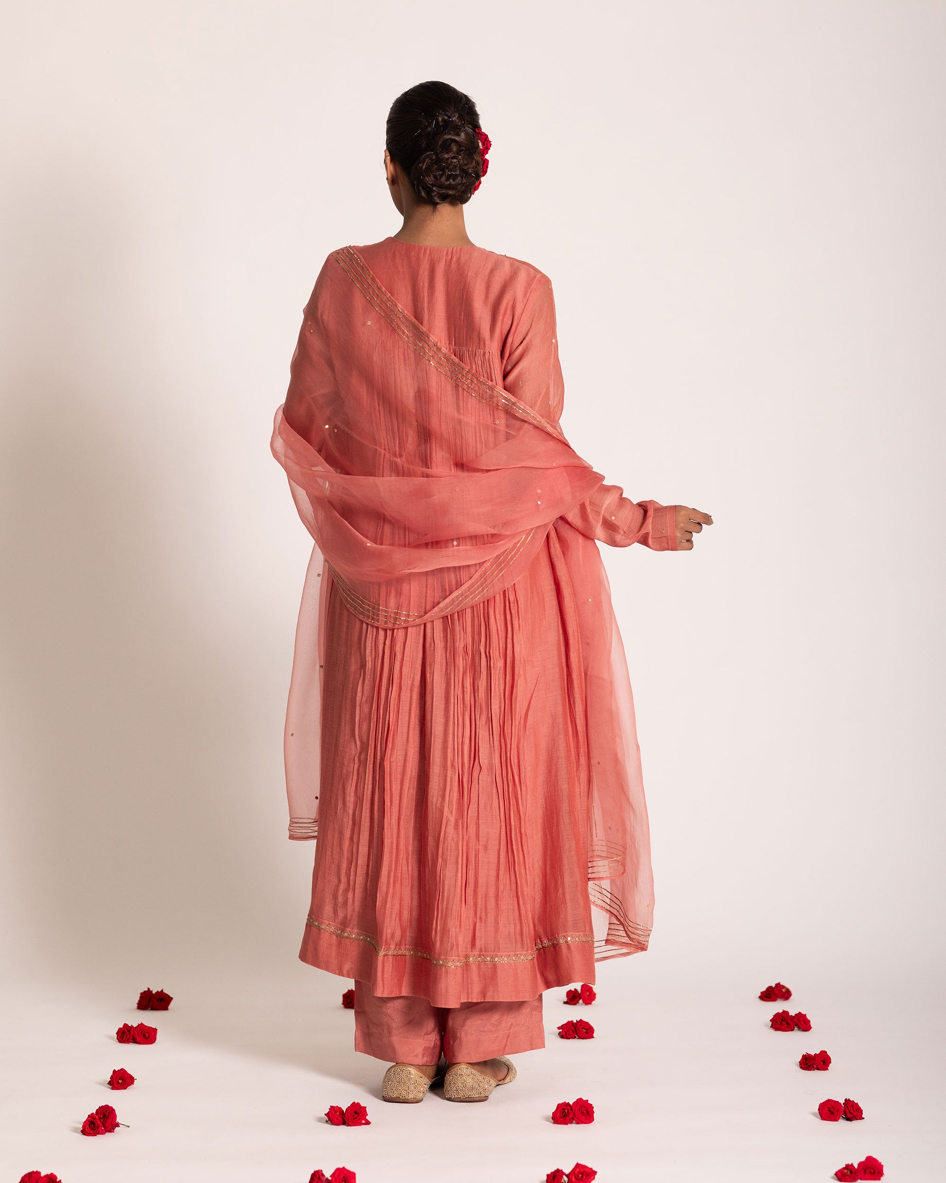 Dark peach gathered salwar set with warm elegant tones and fluid drape, designed for a graceful and effortlessly refined ethnic look.