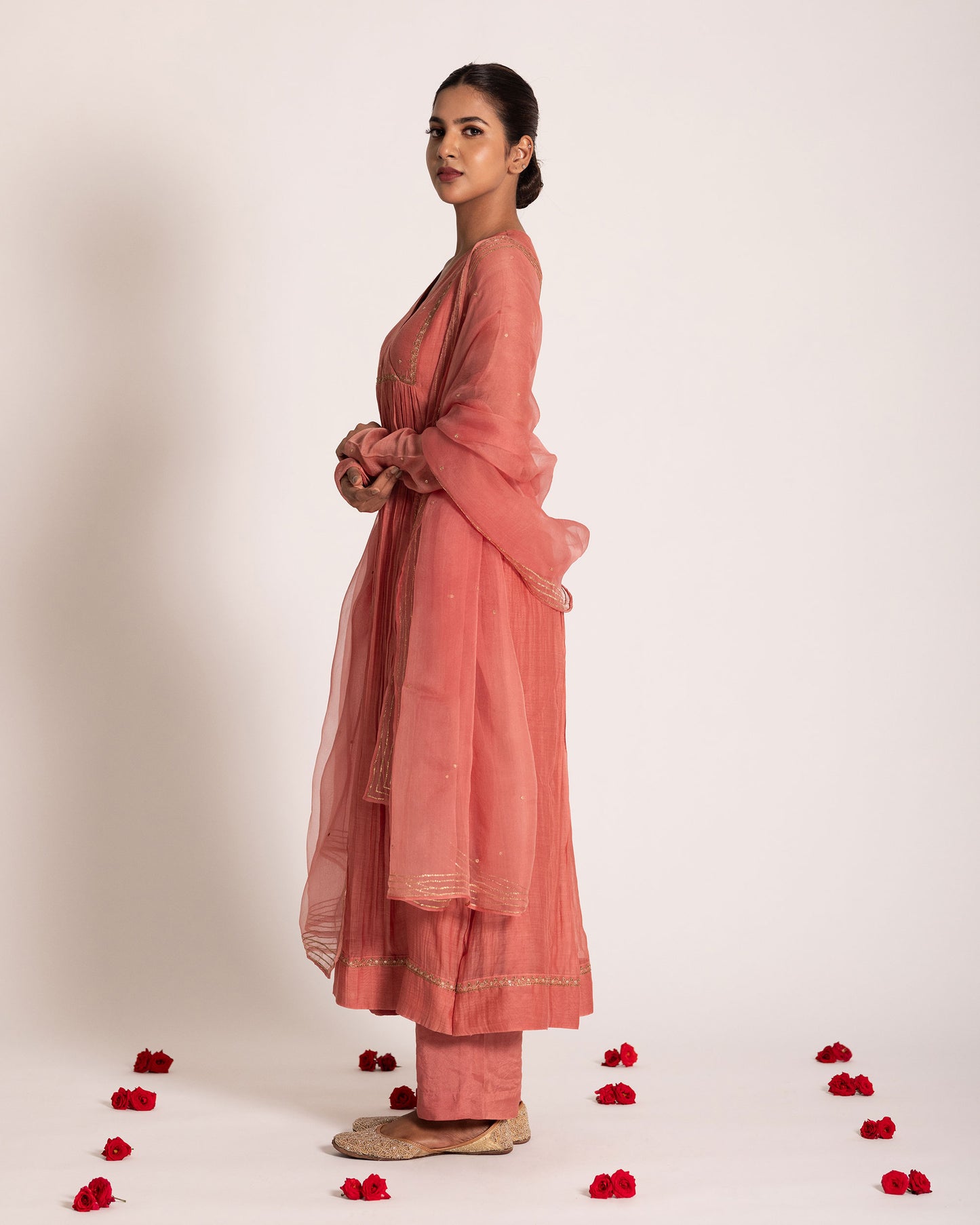 Dark peach gathered salwar set with warm elegant tones and fluid drape, designed for a graceful and effortlessly refined ethnic look.
