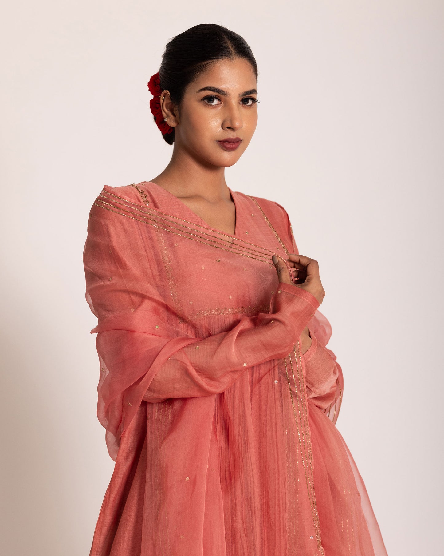 Dark peach gathered salwar set with warm elegant tones and fluid drape, designed for a graceful and effortlessly refined ethnic look.