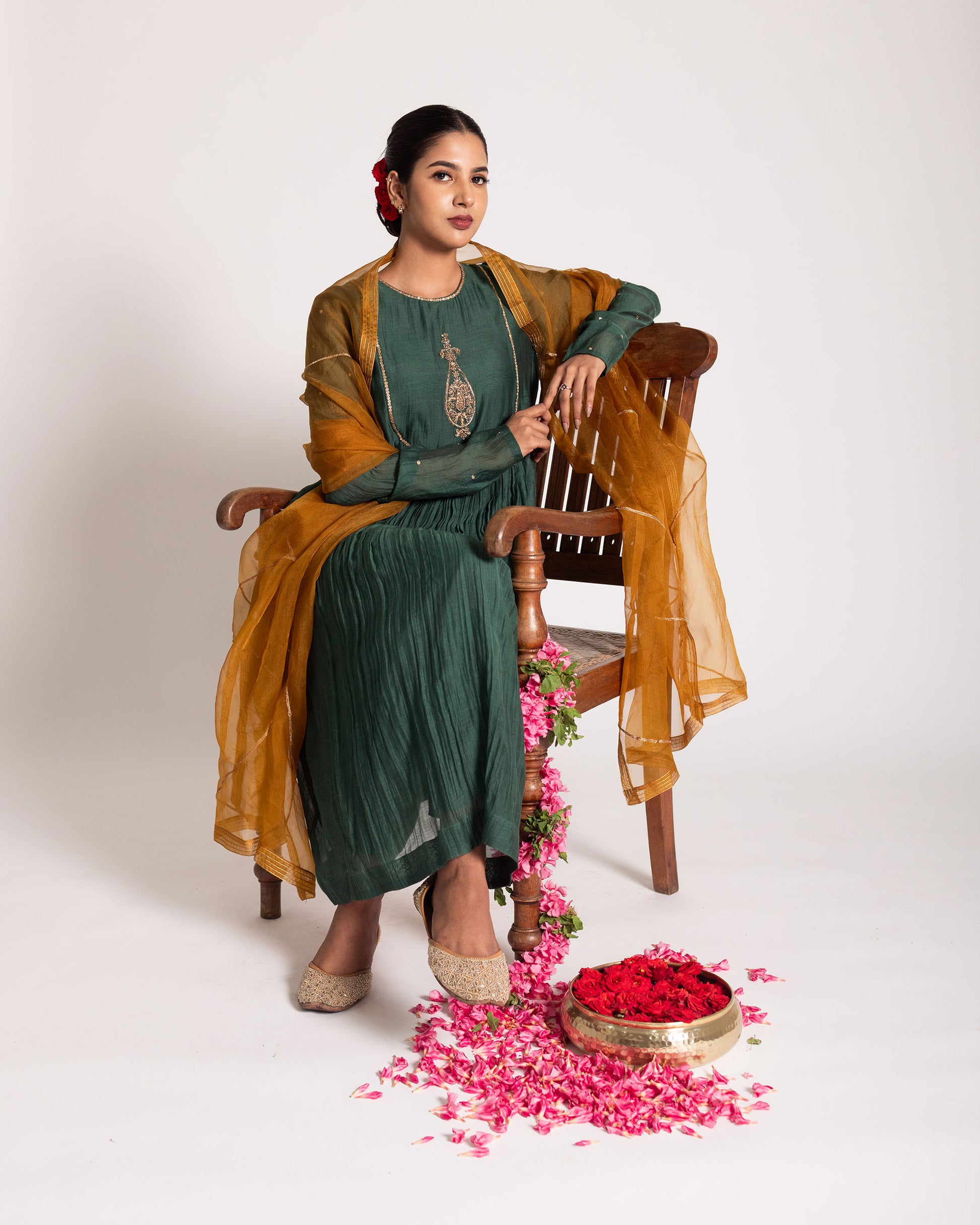 Dark green and burnt yellow salwar set with rich contrasting hues and elegant craftsmanship, creating a bold and sophisticated ethnic ensemble.