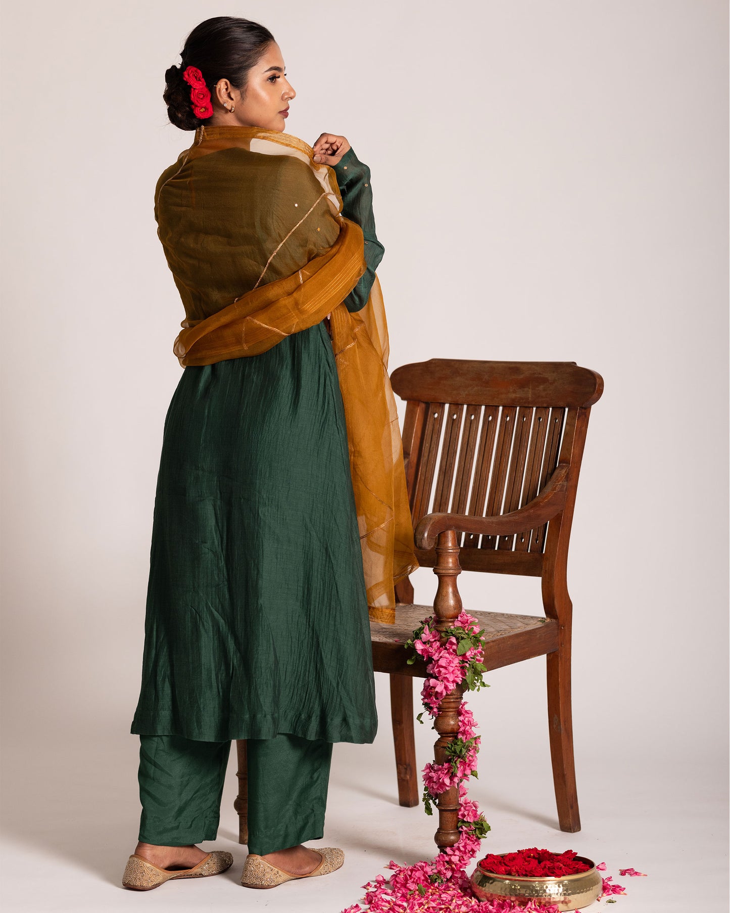 Dark green and burnt yellow salwar set with rich contrasting hues and elegant craftsmanship, creating a bold and sophisticated ethnic ensemble.