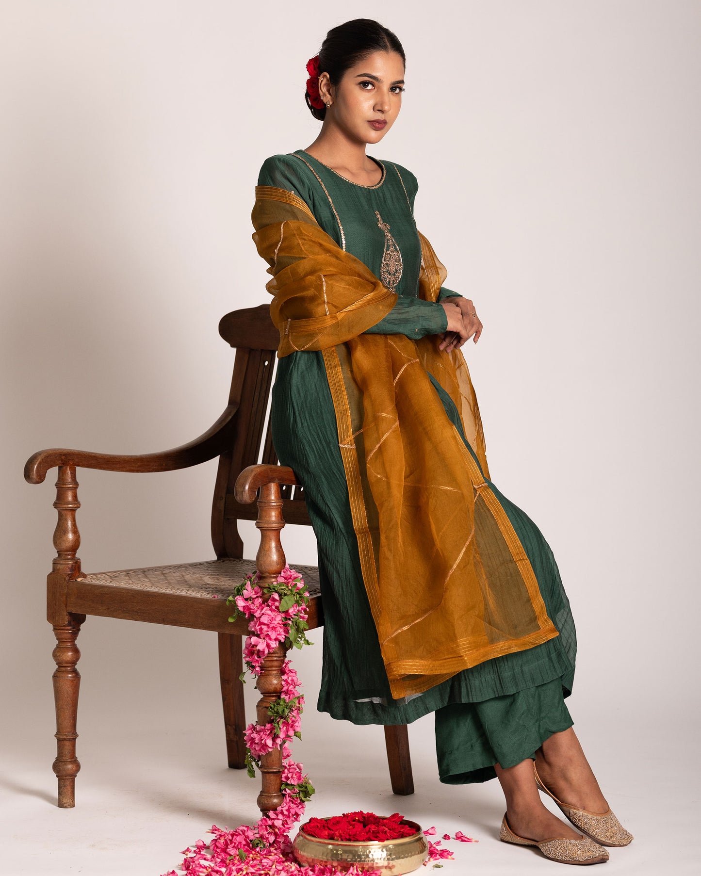 Dark green and burnt yellow salwar set with rich contrasting hues and elegant craftsmanship, creating a bold and sophisticated ethnic ensemble.