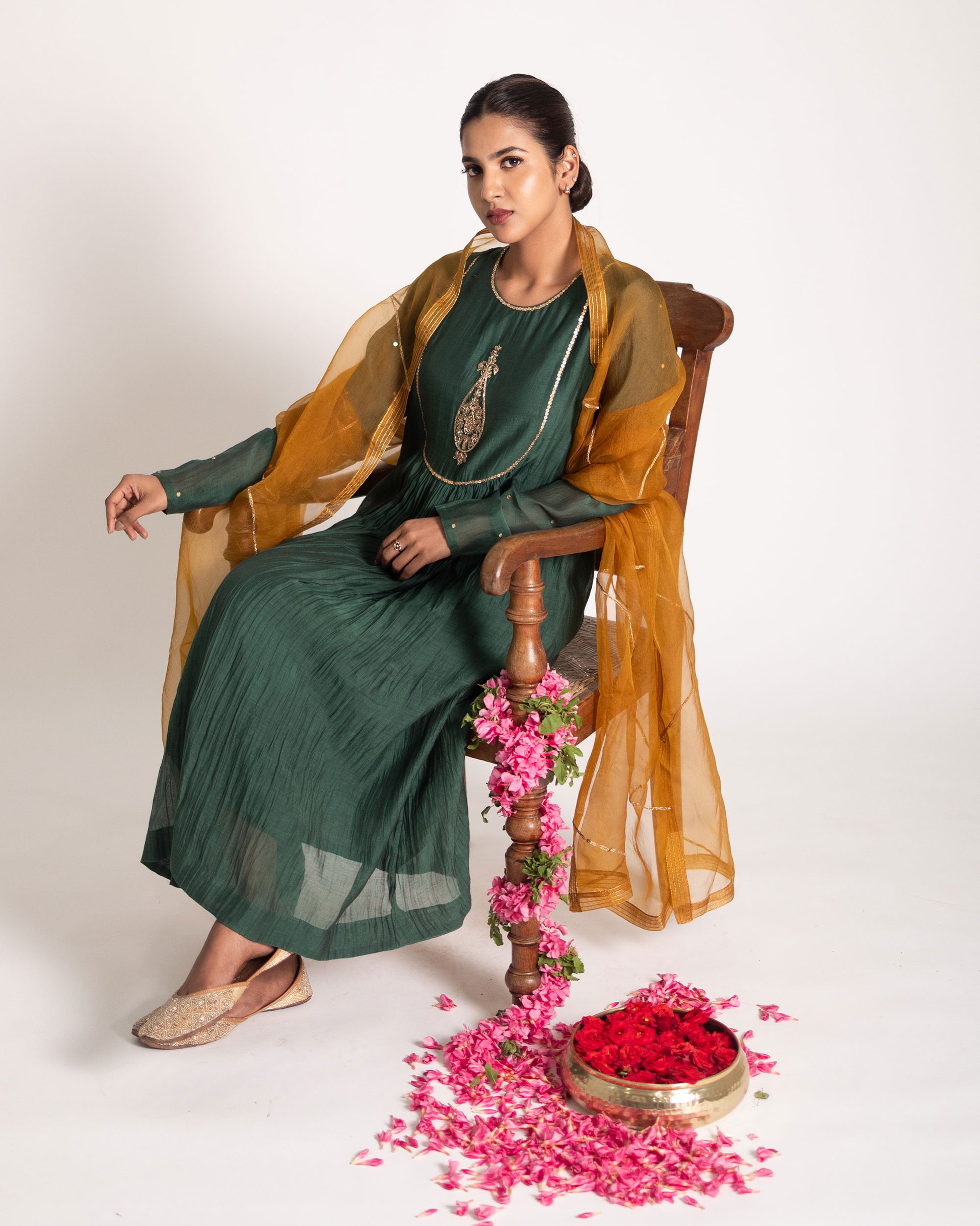 Dark green and burnt yellow salwar set with rich contrasting hues and elegant craftsmanship, creating a bold and sophisticated ethnic ensemble.