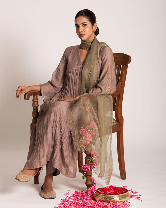 Warm taupe and sage green salwar set with harmonious earthy tones and elegant detailing, crafted for a sophisticated and effortlessly graceful ethnic ensemble.