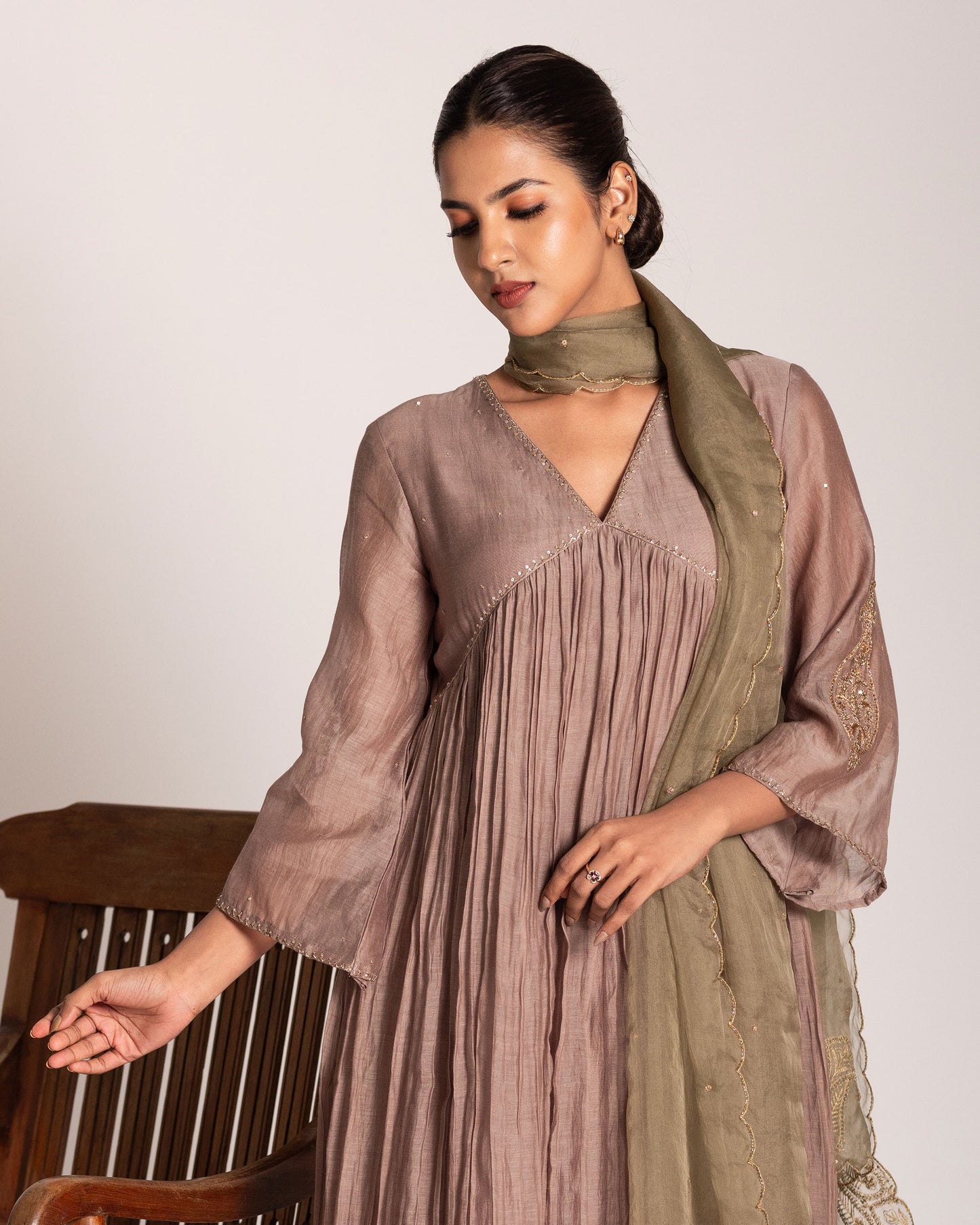 Warm taupe and sage green salwar set with harmonious earthy tones and elegant detailing, crafted for a sophisticated and effortlessly graceful ethnic ensemble.