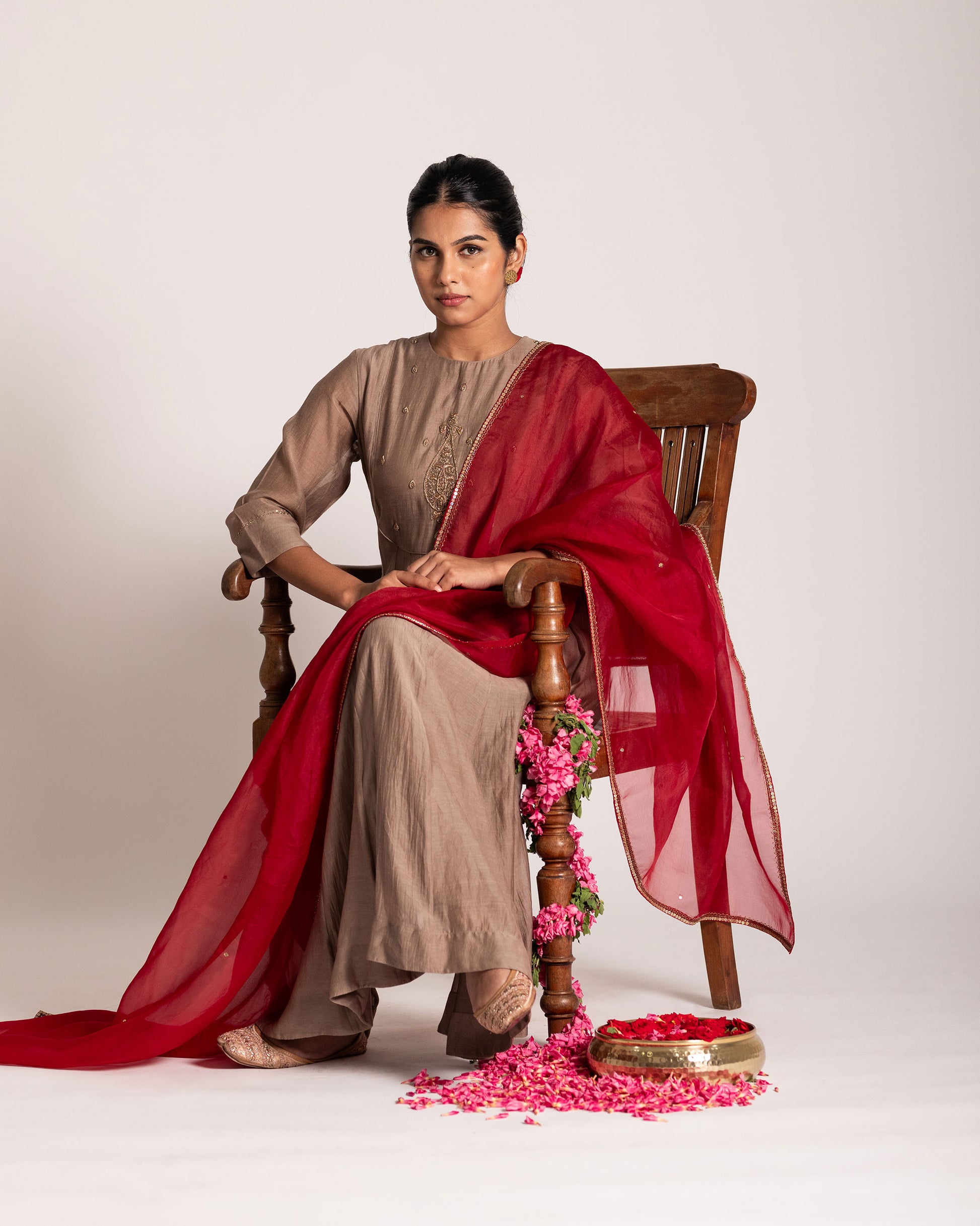 Red and antique bronze Anarkali set with rich festive hues and elegant detailing, crafted for a regal and timeless ethnic statement.