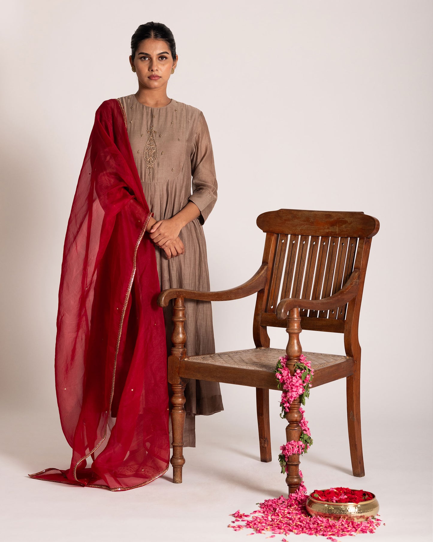 Red and antique bronze Anarkali set with rich festive hues and elegant detailing, crafted for a regal and timeless ethnic statement.