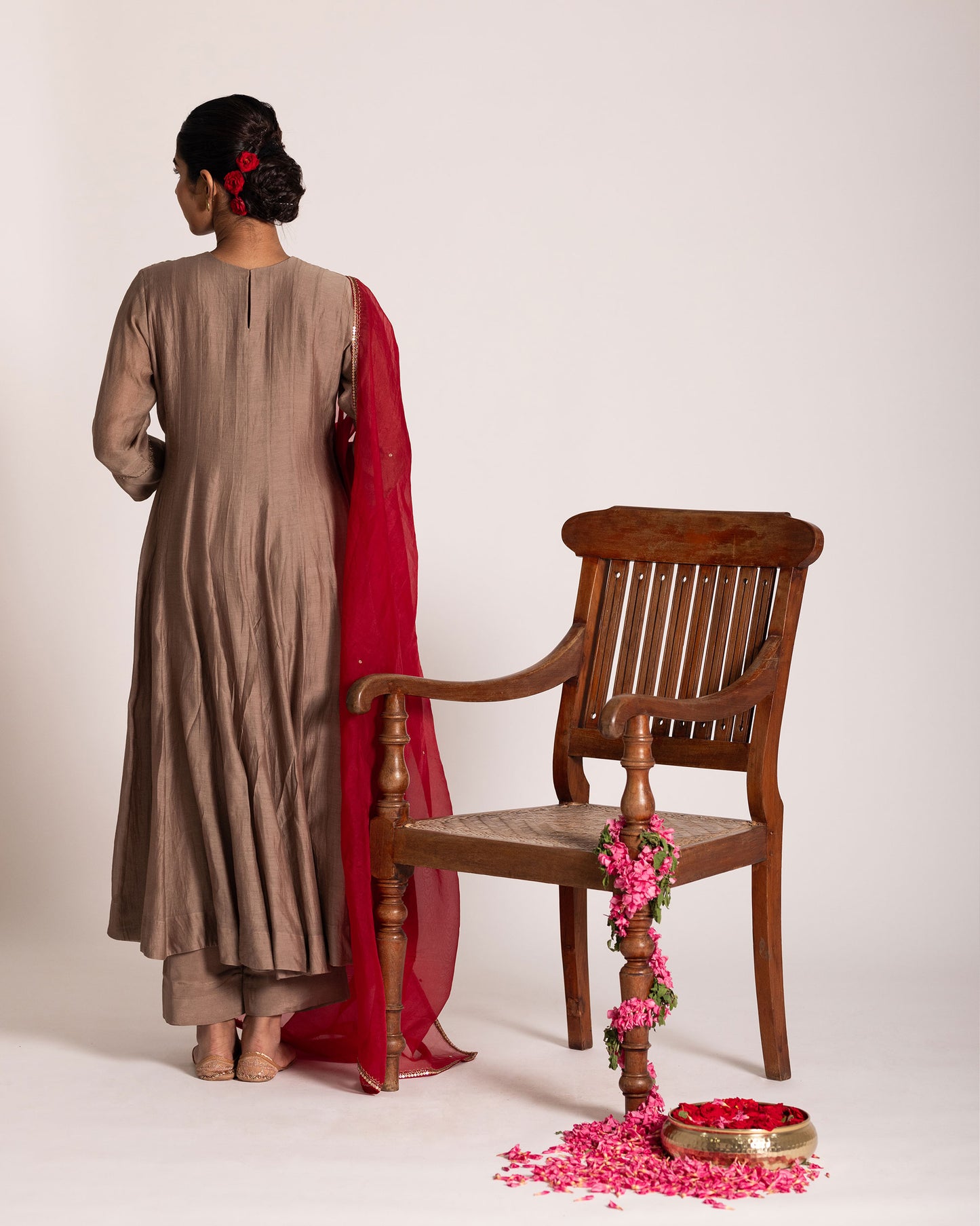 Red and antique bronze Anarkali set with rich festive hues and elegant detailing, crafted for a regal and timeless ethnic statement.