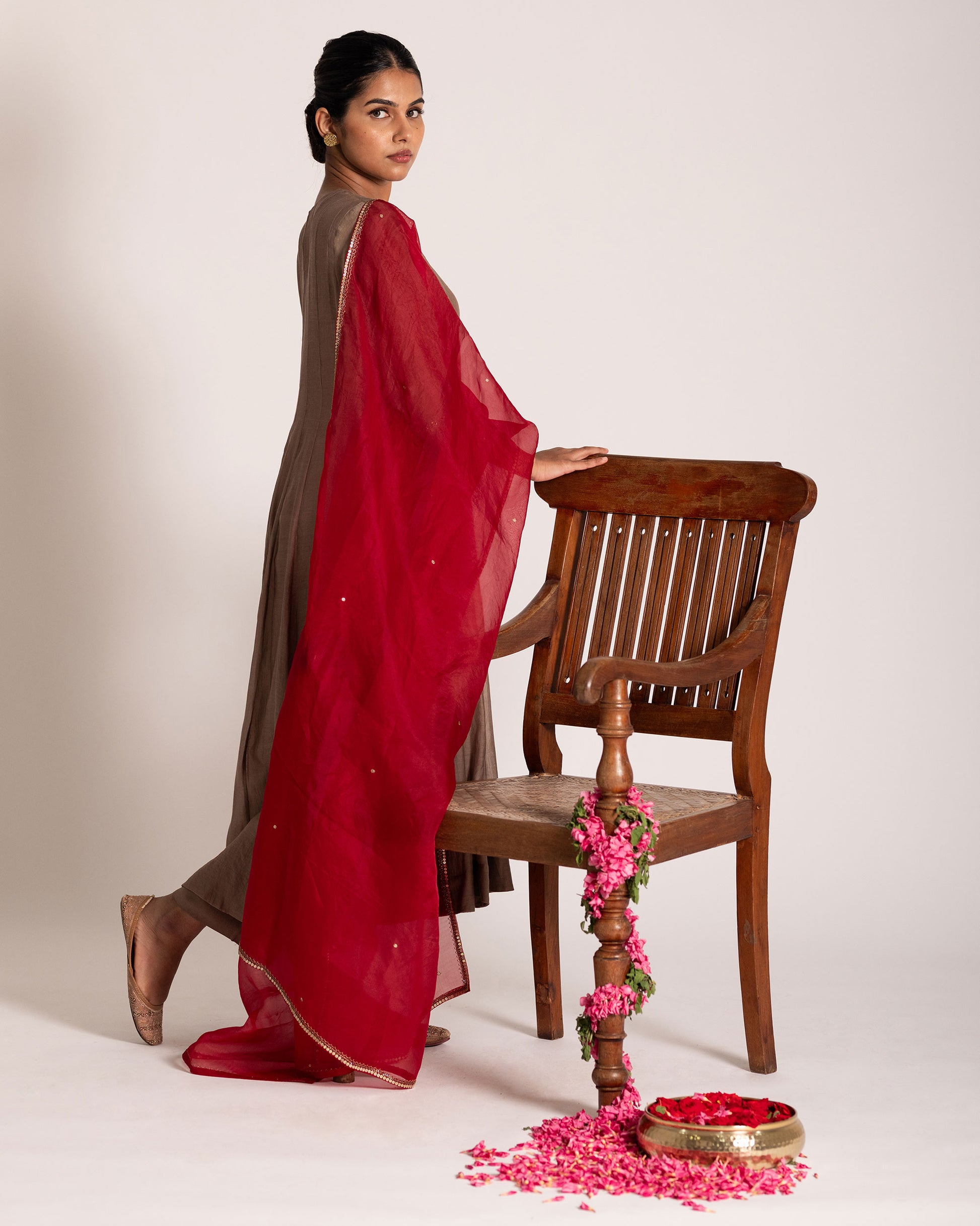 Red and antique bronze Anarkali set with rich festive hues and elegant detailing, crafted for a regal and timeless ethnic statement.