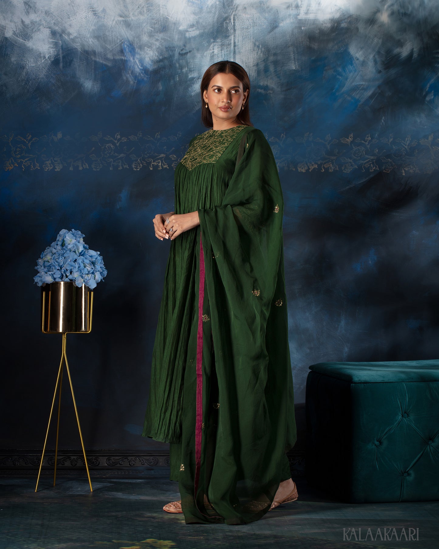 Dark green hand embroidered salwar set with intricate craftsmanship and rich detailing, offering a sophisticated blend of tradition and elegance.