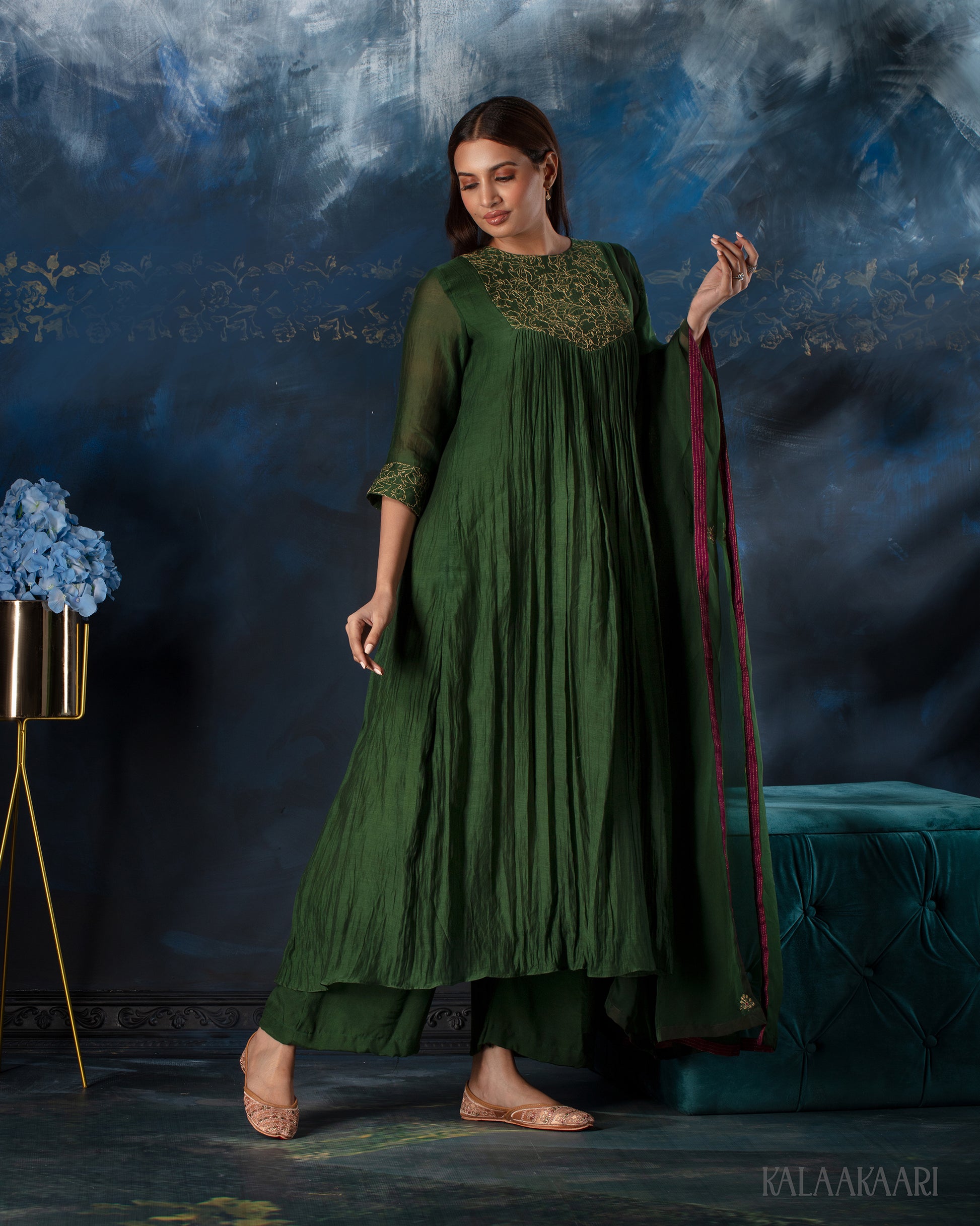 Dark green hand embroidered salwar set with intricate craftsmanship and rich detailing, offering a sophisticated blend of tradition and elegance.