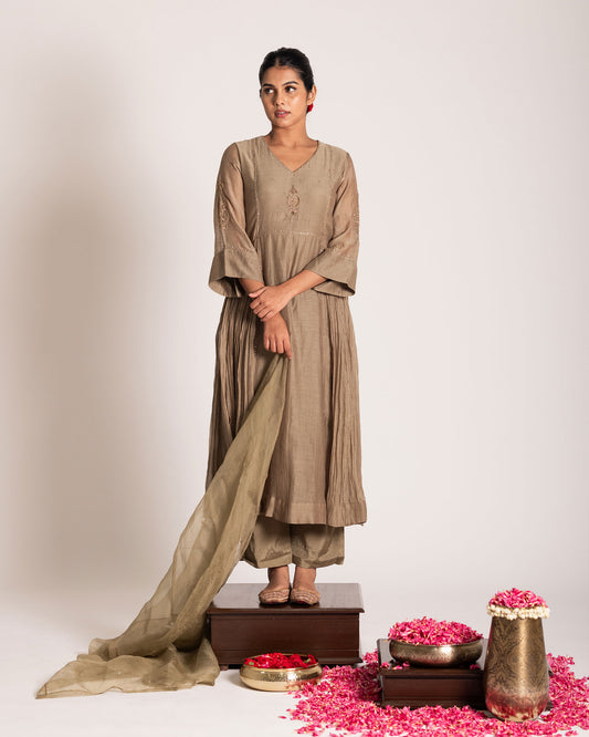 Antique bronze salwar set with rich earthy elegance and timeless detailing, designed for a sophisticated and graceful ethnic ensemble.
