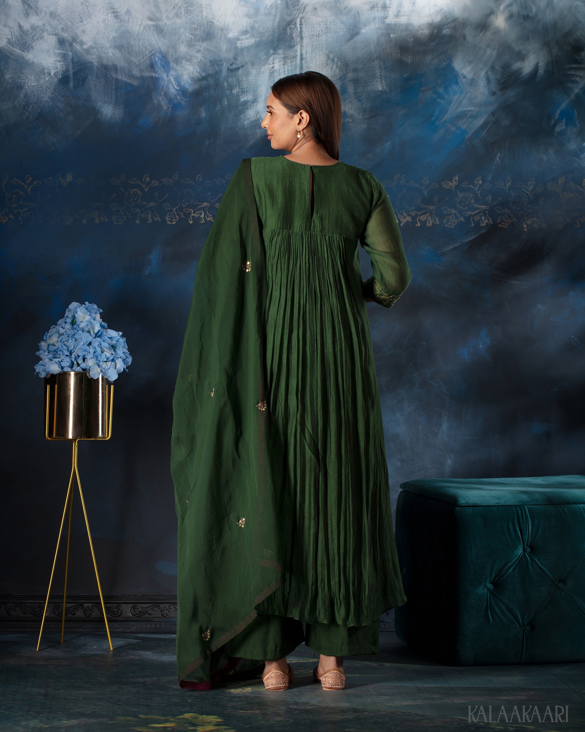 Dark green hand embroidered salwar set with intricate craftsmanship and rich detailing, offering a sophisticated blend of tradition and elegance.