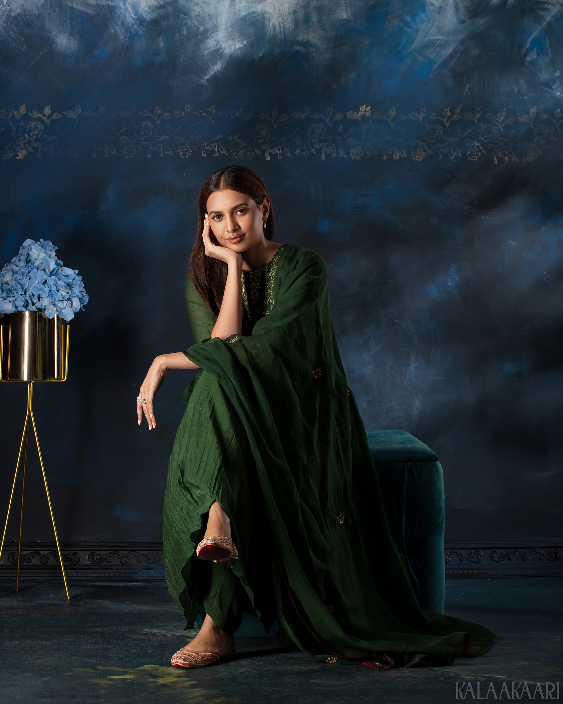 Dark green hand embroidered salwar set with intricate craftsmanship and rich detailing, offering a sophisticated blend of tradition and elegance.