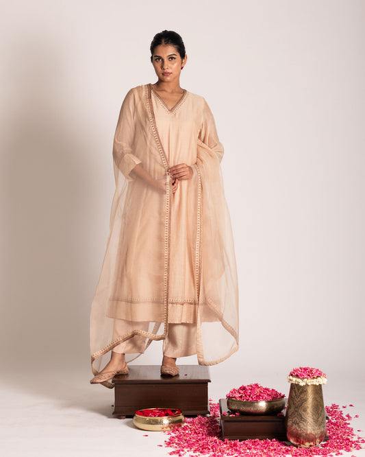 Butter cream salwar set with soft luminous tones and understated elegance, designed for a fresh, graceful, and timeless ethnic ensemble.